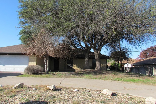 view of front of property with brick siding and an attached garage