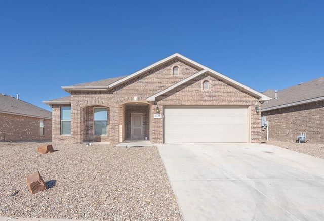 ranch-style home featuring a garage