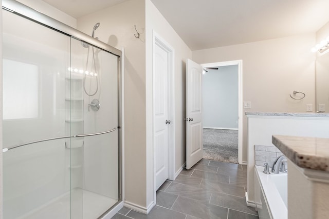 bathroom with shower with separate bathtub