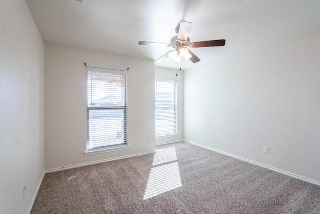 empty room with carpet floors and ceiling fan