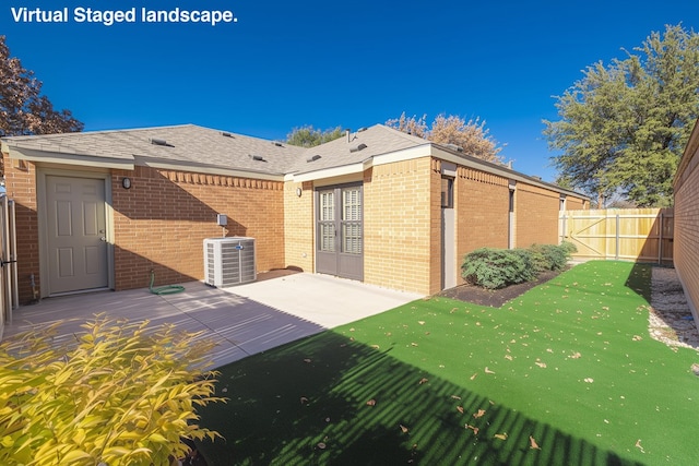 exterior space featuring central AC unit and a patio