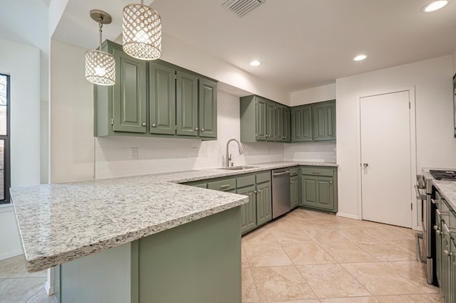 kitchen featuring kitchen peninsula, stainless steel appliances, hanging light fixtures, and green cabinetry