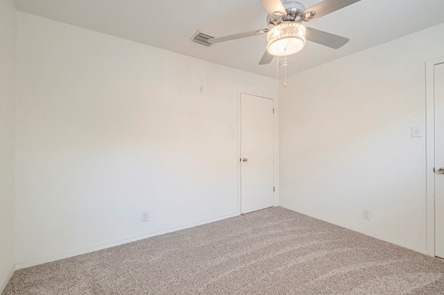 empty room featuring carpet flooring and ceiling fan