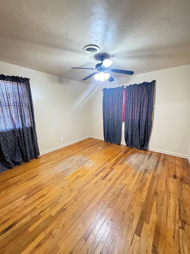2100 42nd St, Snyder, TX 79549 - empty room featuring ceiling fan and light wood-type flooring