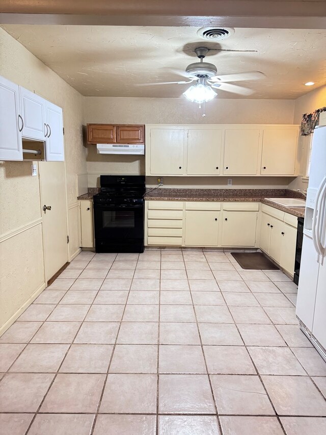 2100 42nd St, Snyder, TX 79549 - kitchen featuring gas stove, ceiling fan, sink, light tile patterned floors, and white fridge with ice dispenser