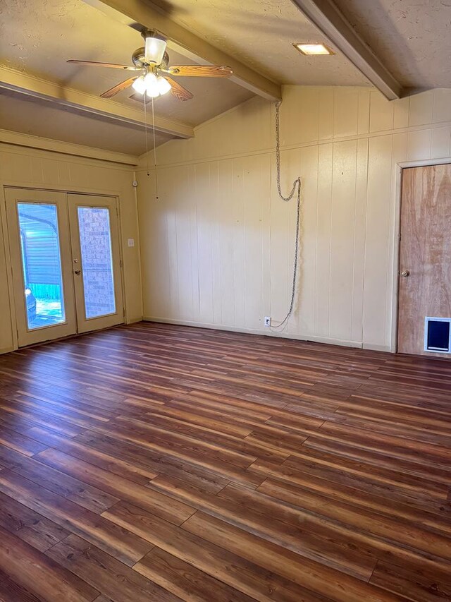 2100 42nd St, Snyder, TX 79549 - unfurnished room with french doors, lofted ceiling with beams, dark hardwood / wood-style floors, and ceiling fan