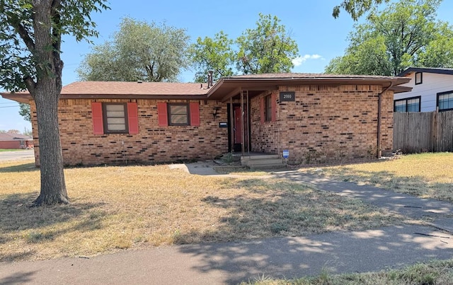 single story home with a front yard