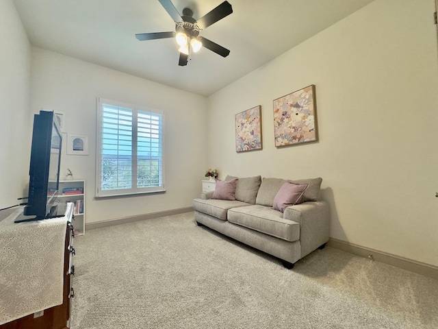 living room with carpet and ceiling fan