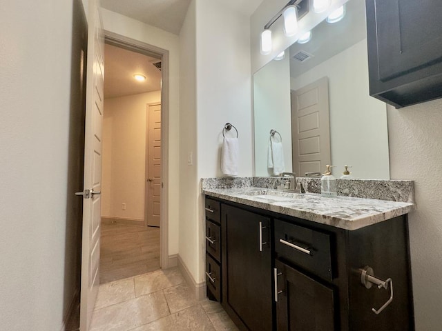 bathroom featuring vanity and wood-type flooring