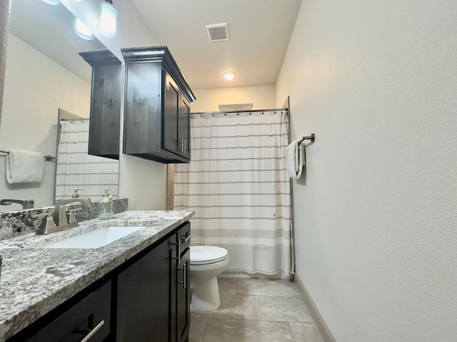 bathroom with walk in shower, vanity, and toilet