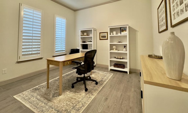 home office featuring dark hardwood / wood-style floors and ornamental molding