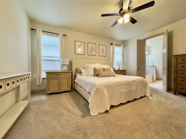 carpeted bedroom with ceiling fan and multiple windows