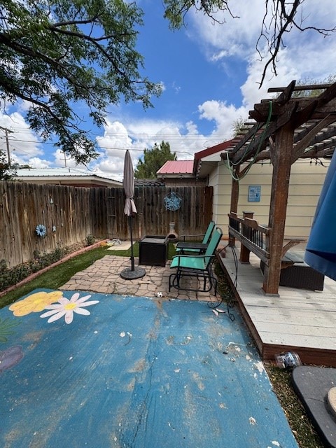 906 W 5th St, Fort Stockton, TX 79735 - fenced backyard with a pergola, a patio area, and a deck