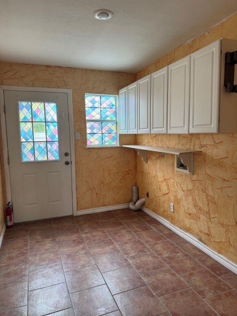 906 W 5th St, Fort Stockton, TX 79735 - laundry room with cabinet space and baseboards