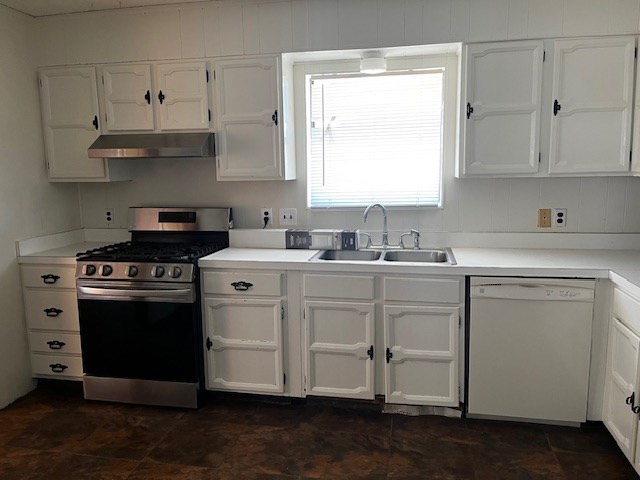 kitchen featuring white dishwasher, white cabinets, stainless steel range with gas cooktop, and sink