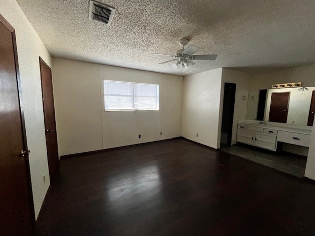 unfurnished bedroom featuring a textured ceiling and ceiling fan