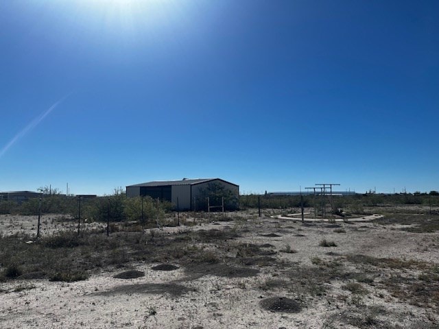 view of yard with a rural view