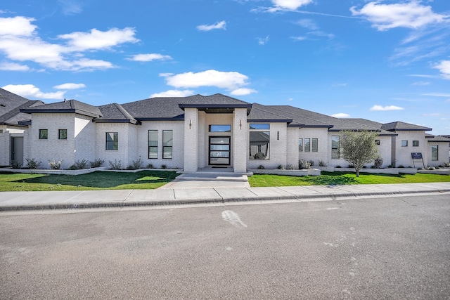 view of front of house with a front lawn