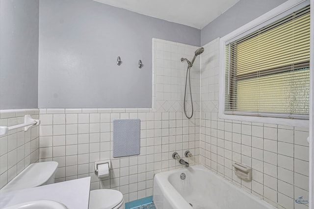 3404 W Michigan Ave, Midland, TX 79703 - bathroom with toilet, tile walls, shower / washtub combination, wainscoting, and vanity