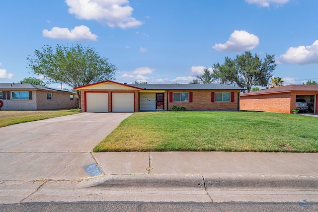 3404 W Michigan Ave, Midland, TX 79703 - ranch-style house featuring an attached garage, a front yard, concrete driveway, and brick siding