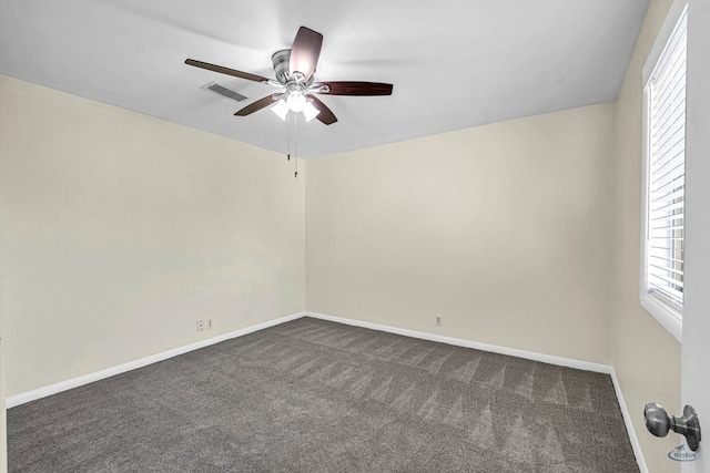 3404 W Michigan Ave, Midland, TX 79703 - spare room with dark colored carpet, ceiling fan, healthy amount of natural light, and baseboards
