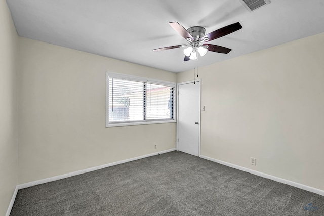 3404 W Michigan Ave, Midland, TX 79703 - unfurnished room with dark carpet, ceiling fan, and baseboards
