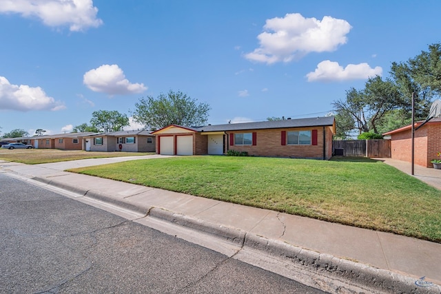 3404 W Michigan Ave, Midland, TX 79703 - ranch-style home featuring an attached garage, concrete driveway, and brick siding