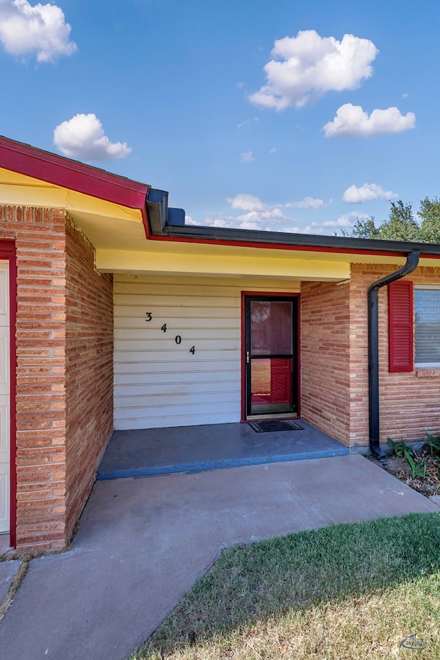 3404 W Michigan Ave, Midland, TX 79703 - property entrance featuring brick siding