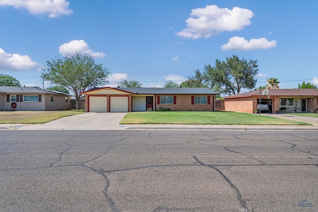 3404 W Michigan Ave, Midland, TX 79703 - ranch-style house with a garage, concrete driveway, a front yard, and brick siding