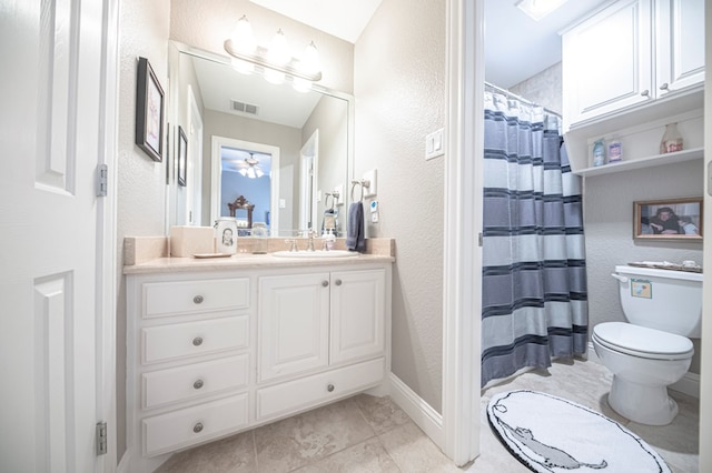 bathroom with a shower with curtain, vanity, and toilet