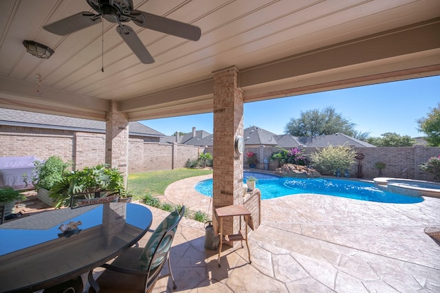 view of swimming pool with an in ground hot tub and a patio