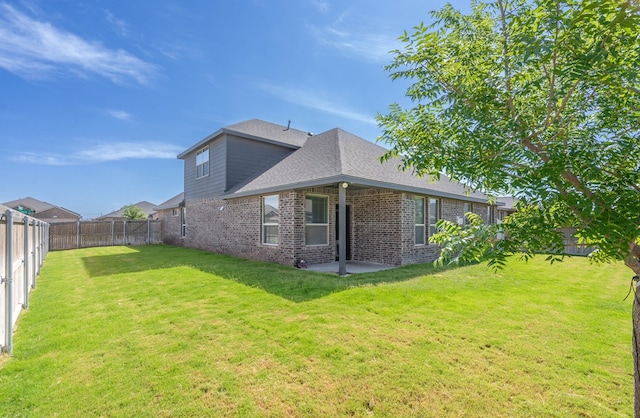 1212 Santa Clara, Midland, TX 79705 - back of property with brick siding, a fenced backyard, roof with shingles, and a patio area