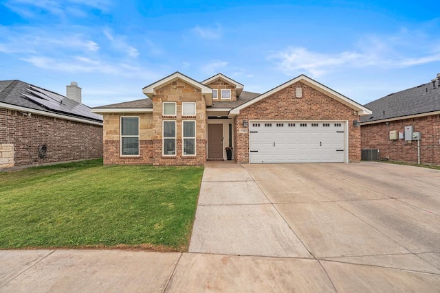 9910 Aloe Ct, Odessa, TX 79765 - view of front facade featuring driveway, an attached garage, a front yard, and brick siding
