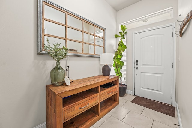 9910 Aloe Ct, Odessa, TX 79765 - foyer entrance featuring light tile patterned floors and baseboards
