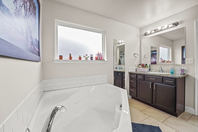 9910 Aloe Ct, Odessa, TX 79765 - bathroom featuring vanity, tile patterned flooring, and a bath