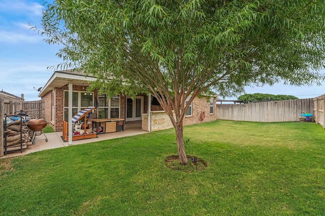 9910 Aloe Ct, Odessa, TX 79765 - fenced backyard with a patio