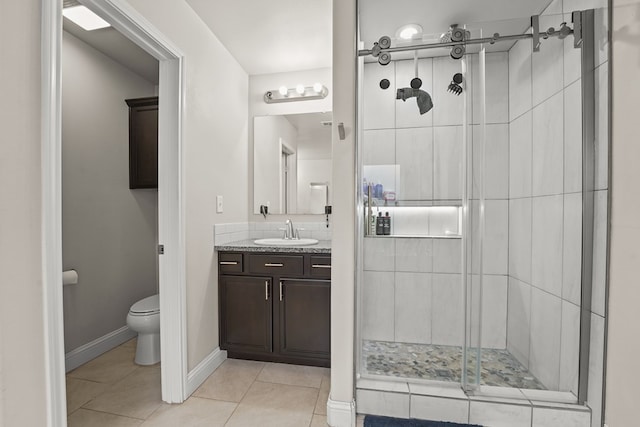 9910 Aloe Ct, Odessa, TX 79765 - bathroom with a shower stall, tile patterned flooring, and vanity