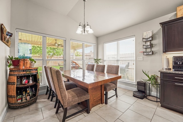 9910 Aloe Ct, Odessa, TX 79765 - dining space with a chandelier, light tile patterned floors, and high vaulted ceiling