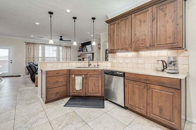 kitchen featuring a peninsula, dishwasher, crown molding, and a sink