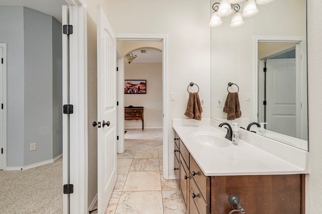 bathroom with baseboards and vanity