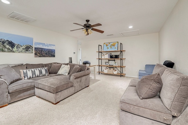 living area with attic access, light colored carpet, visible vents, and recessed lighting