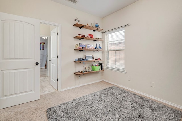 unfurnished room with visible vents and baseboards