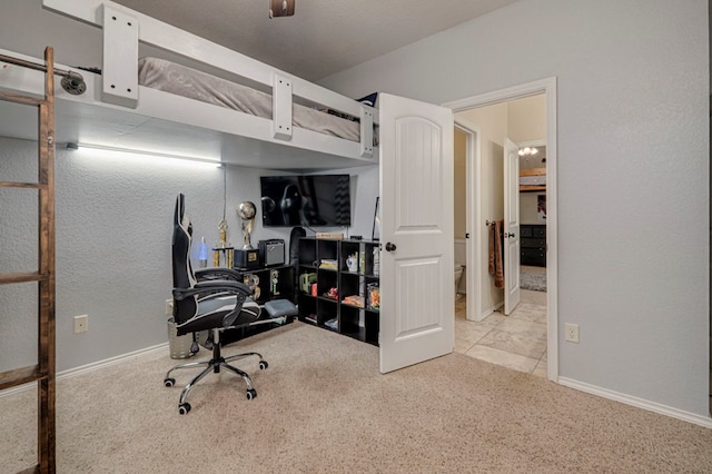 bedroom featuring baseboards and light colored carpet