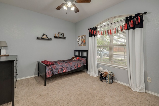 bedroom with baseboards, carpet flooring, and ceiling fan