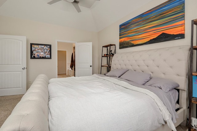 carpeted bedroom featuring lofted ceiling and a ceiling fan