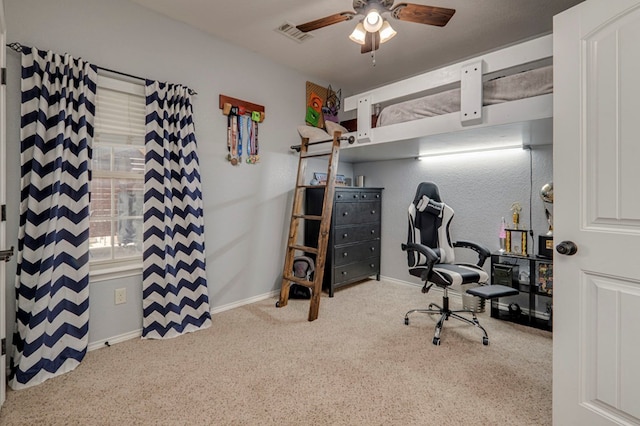 carpeted bedroom featuring visible vents, a ceiling fan, and baseboards