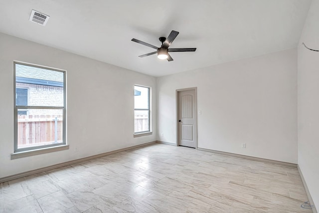 empty room featuring ceiling fan