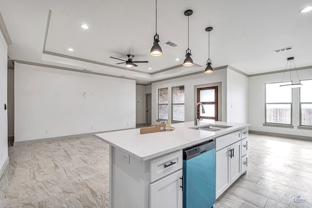 kitchen featuring dishwasher, sink, white cabinets, a kitchen island with sink, and a raised ceiling