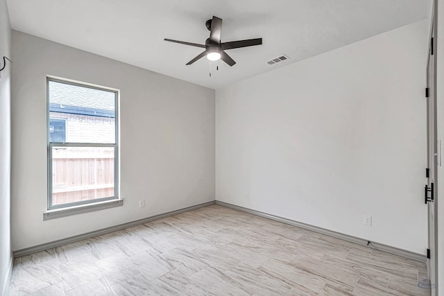 unfurnished room with ceiling fan