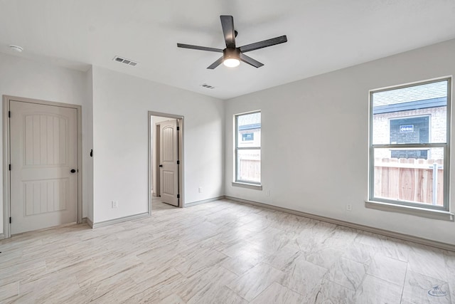 interior space with ceiling fan